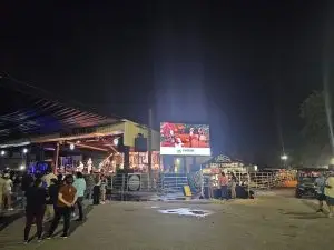 Presentation screen showing band performing on stage